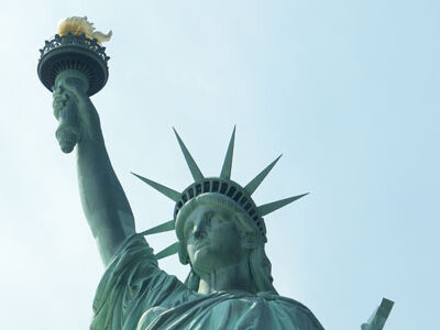 statue of liberty head and arm with torch