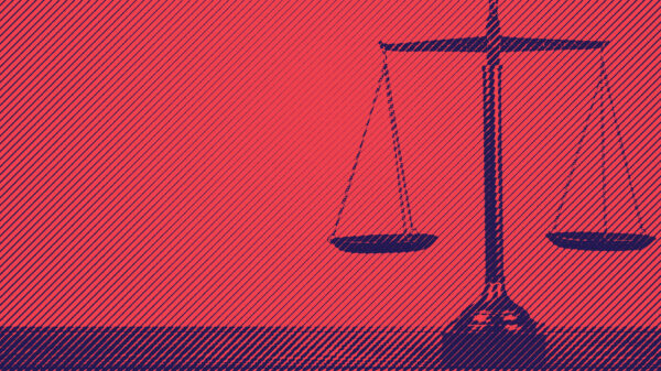 Blue scales of justice on red background