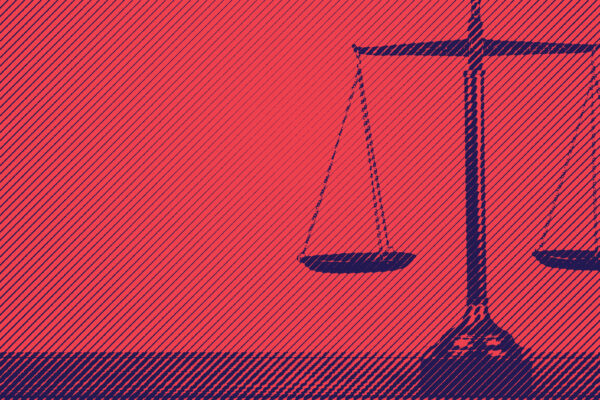 Blue scales of justice on red background