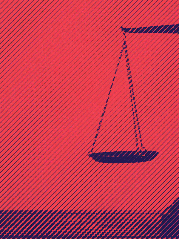 Blue scales of justice on red background