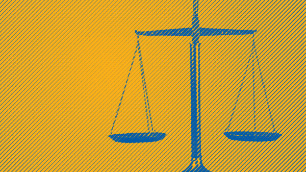 Blue scales of justice on yellow background