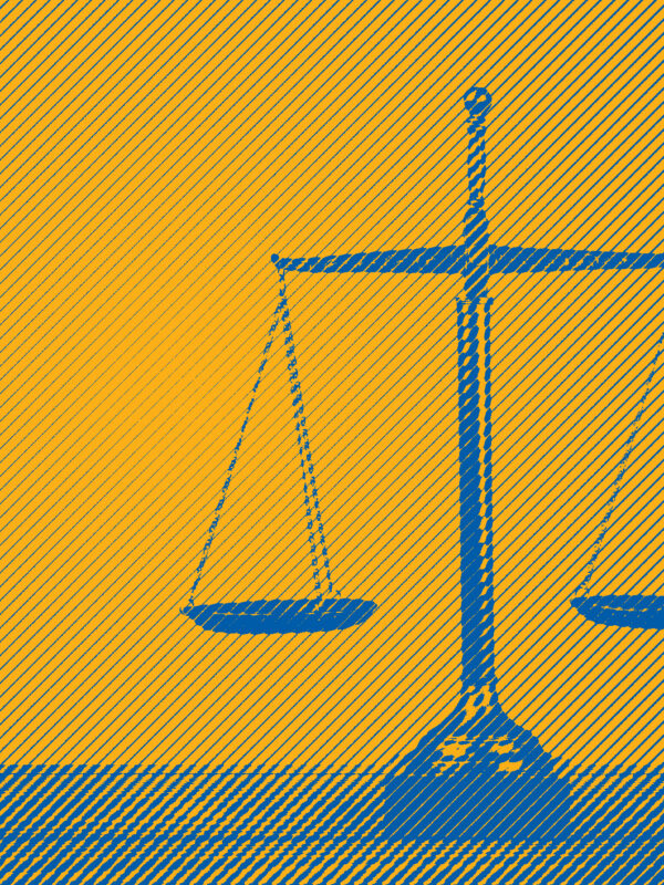 Blue scales of justice on yellow background