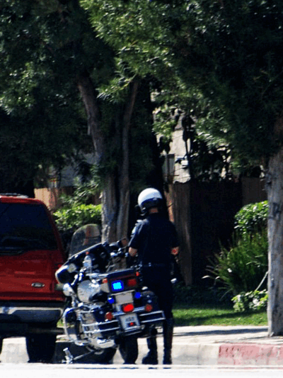 Police officer pulls car over for a traffic stop