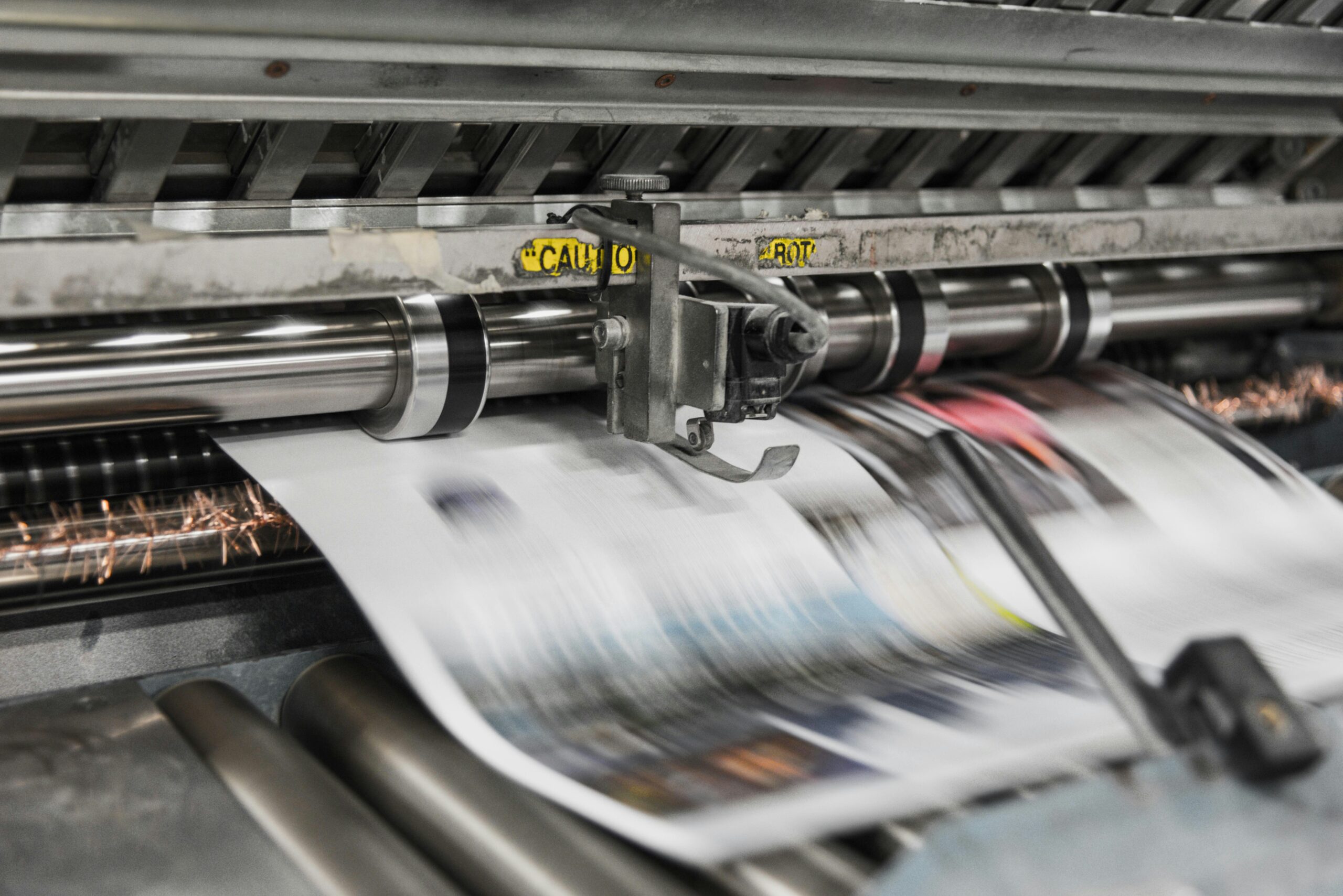 Newspaper coming off a printer