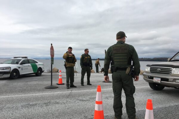 Customs and Border Patrol Agents stopping a vehicle for inspection in Vermont.