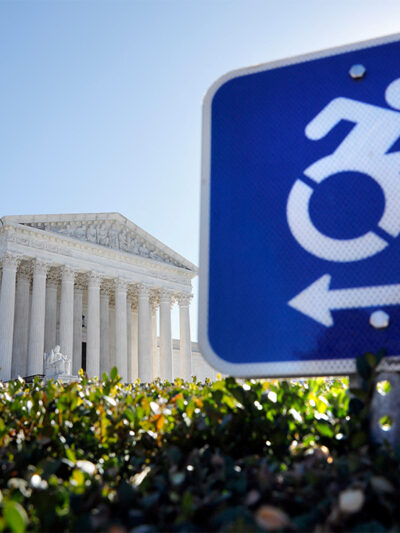 A wheelchair accessibility sign in front of the Supreme Court.