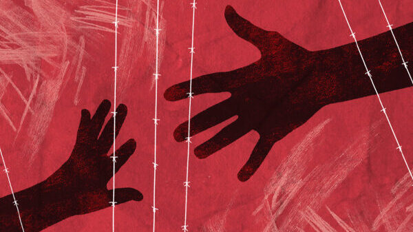 Red background with hands reaching for each other and barbed wire overlay.