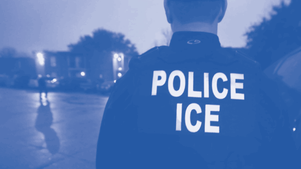 Police ICE agent in blue monotone treatment