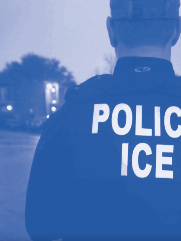 Police ICE agent in blue monotone treatment