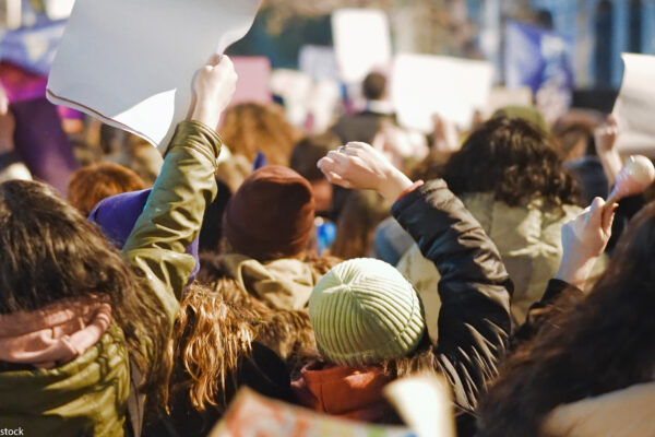 A backward view of protesters.