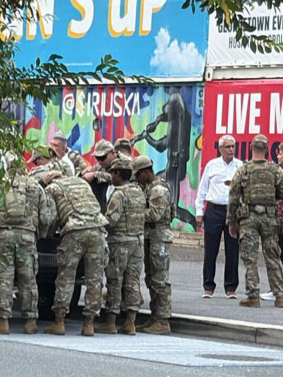 A group of National Guard troops speaking to DC civilians.
