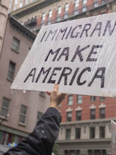 A protest sign from a No Kings rally that says "Immigrants Make America."