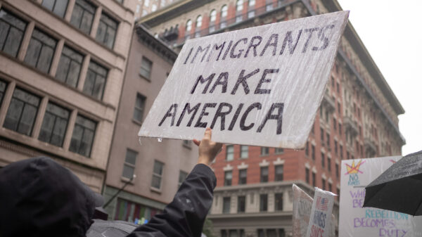 A protest sign from a No Kings rally that says "Immigrants Make America."