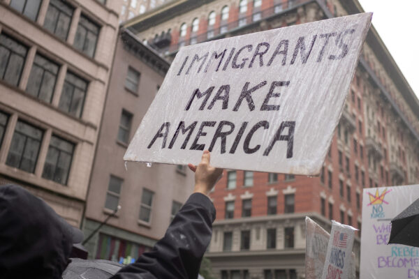 A protest sign from a No Kings rally that says "Immigrants Make America."