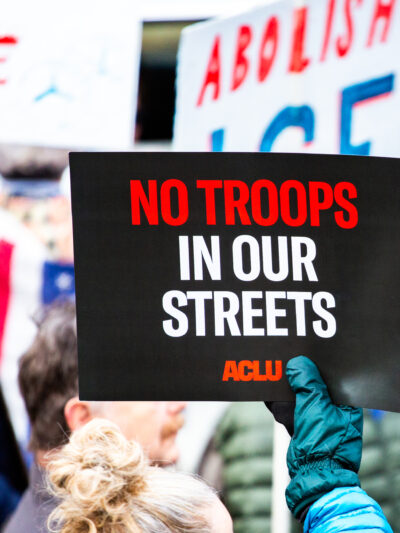 No Troops in Our Street poster at a protest in Portland, Maine.