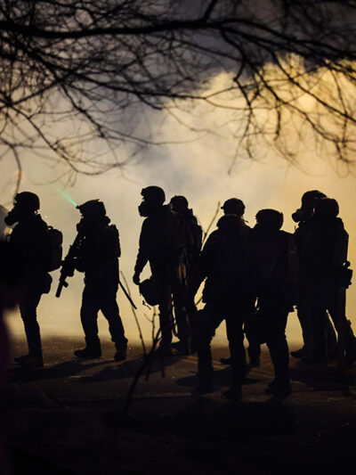 Federal law enforcement deploys gas at the site of a reported shooting in North Minneapolis.