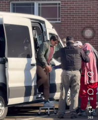 Screenshot of picture posted to social media by bystander showing Carvajal-Muñoz being transferred at Kittery police station.