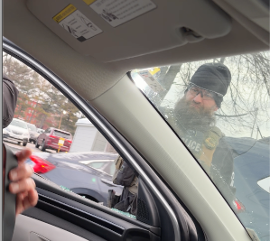 Agent Ravencamp pointing taser at Sebastian through smashed driver’s-side window.