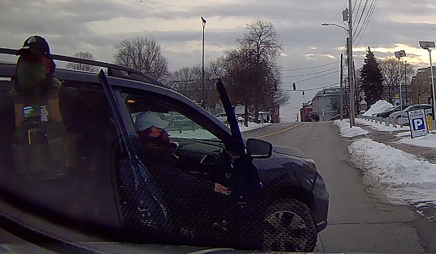 Masked Agent John Doe No. 1 and masked Agent Jane Doe No. 1 exiting the unmarked SUV to surround Sebastián’s car.