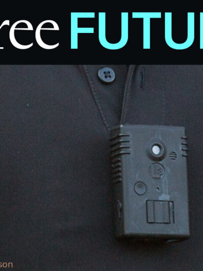 Closeup of a body camera on a man's black polo shirt