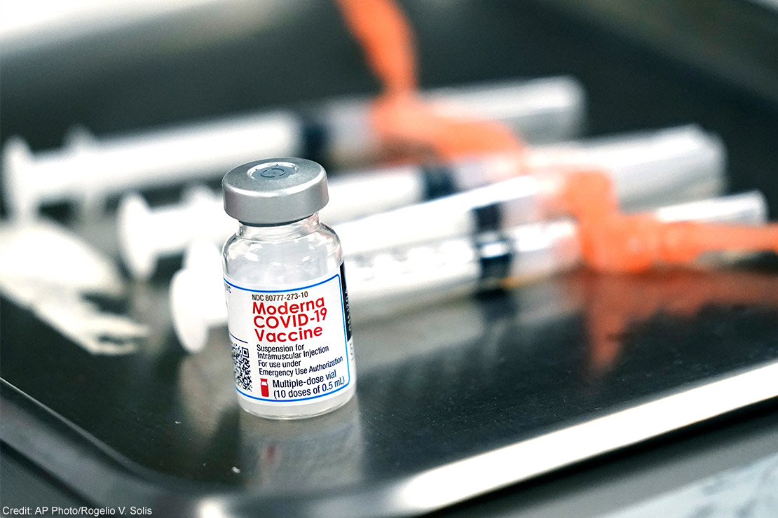 Syringes with doses of the Moderna COVID-19 vaccine on a surgical tray.
