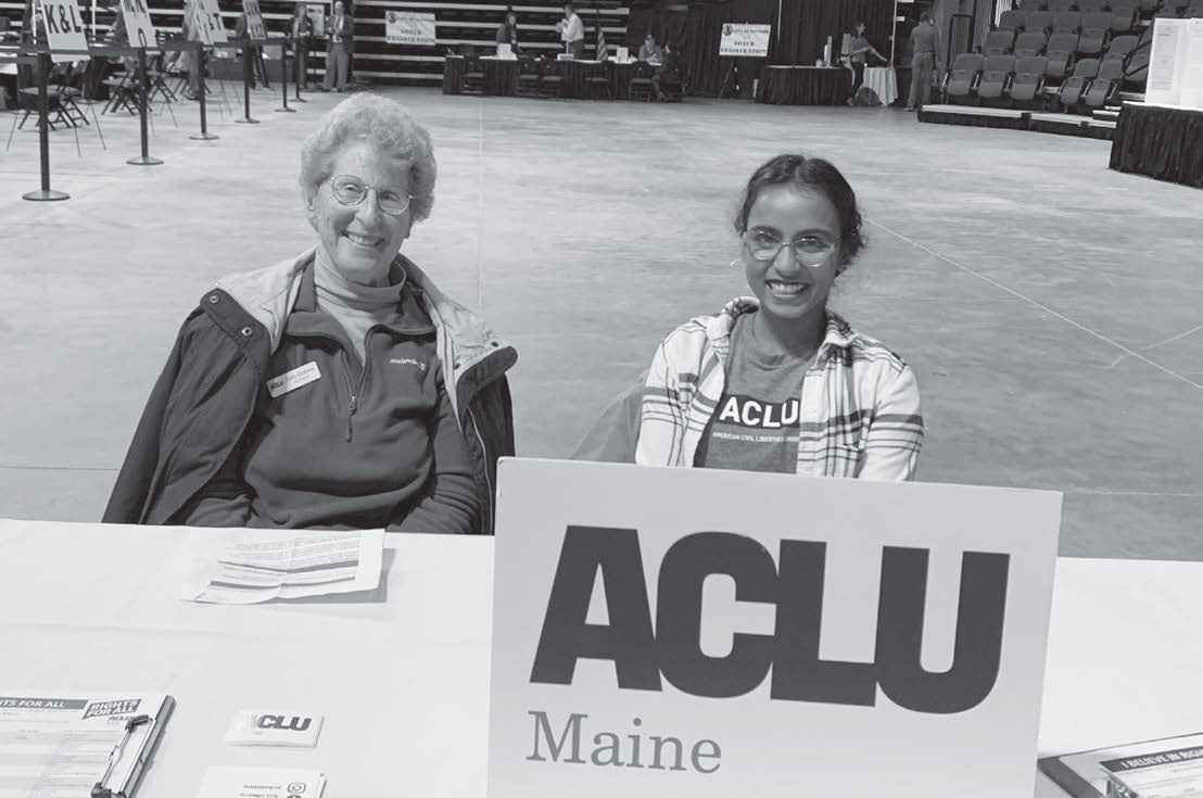 Dhivya Singaram, Engagement Coordinator/Organizer, and volunteer tabling at Bangor Polls