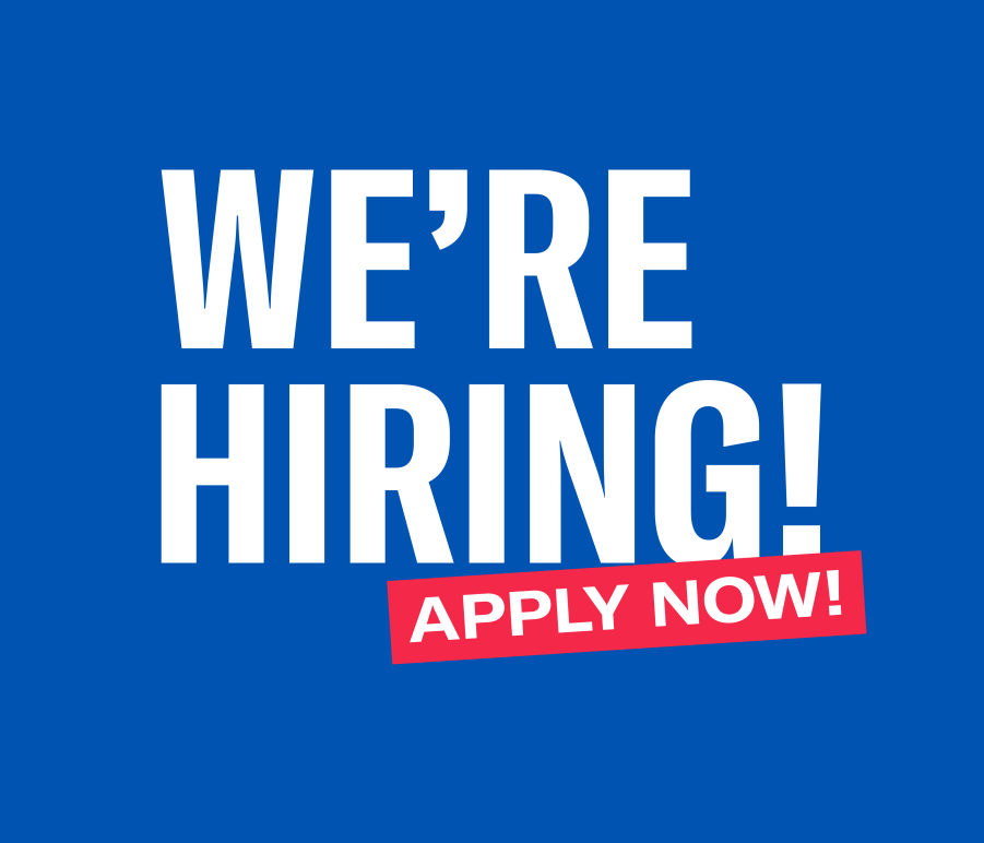 Blue background with white lettering reading "We're Hiring!" Below, "apply now!" written in white on red box placed over the bottom of "hiring" at an angle.