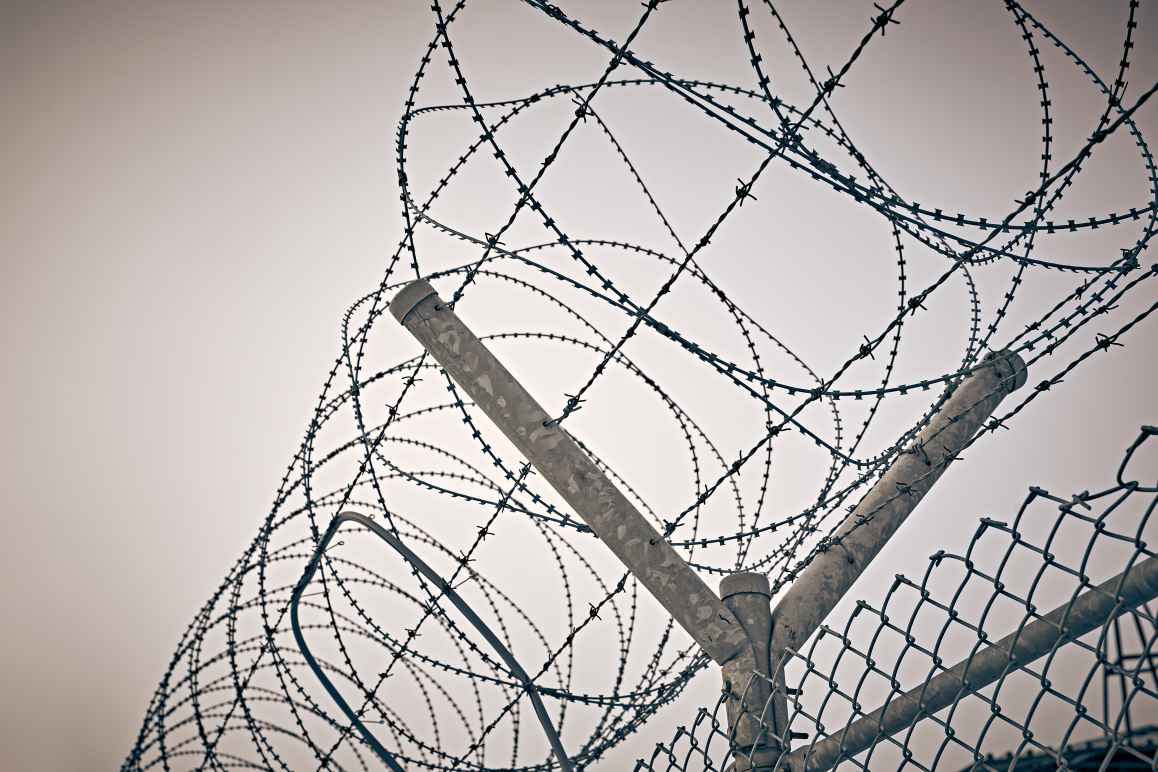 Razor wire on top of a fence