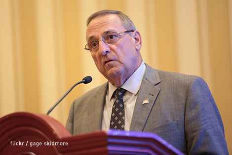 Gov. Paul LePage speaking at a podium