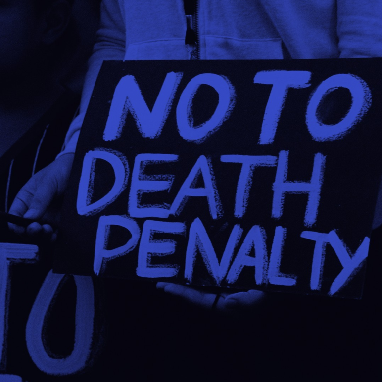 Person holding poster that reads "NO TO DEATH PENALTY"