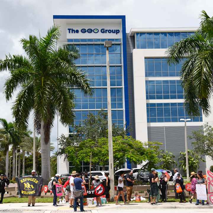 Protestors march in front of the ICE Company, The Geo Group building, demanding the end of private prisons.