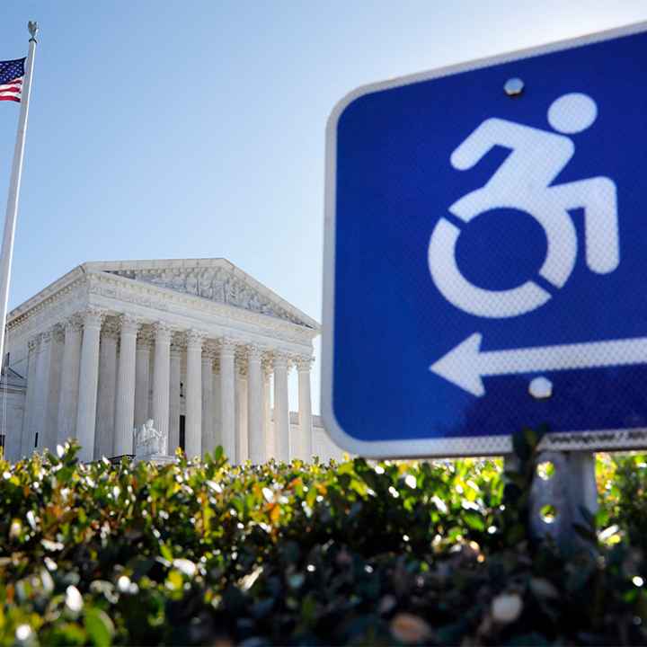 A wheelchair accessibility sign in front of the Supreme Court.